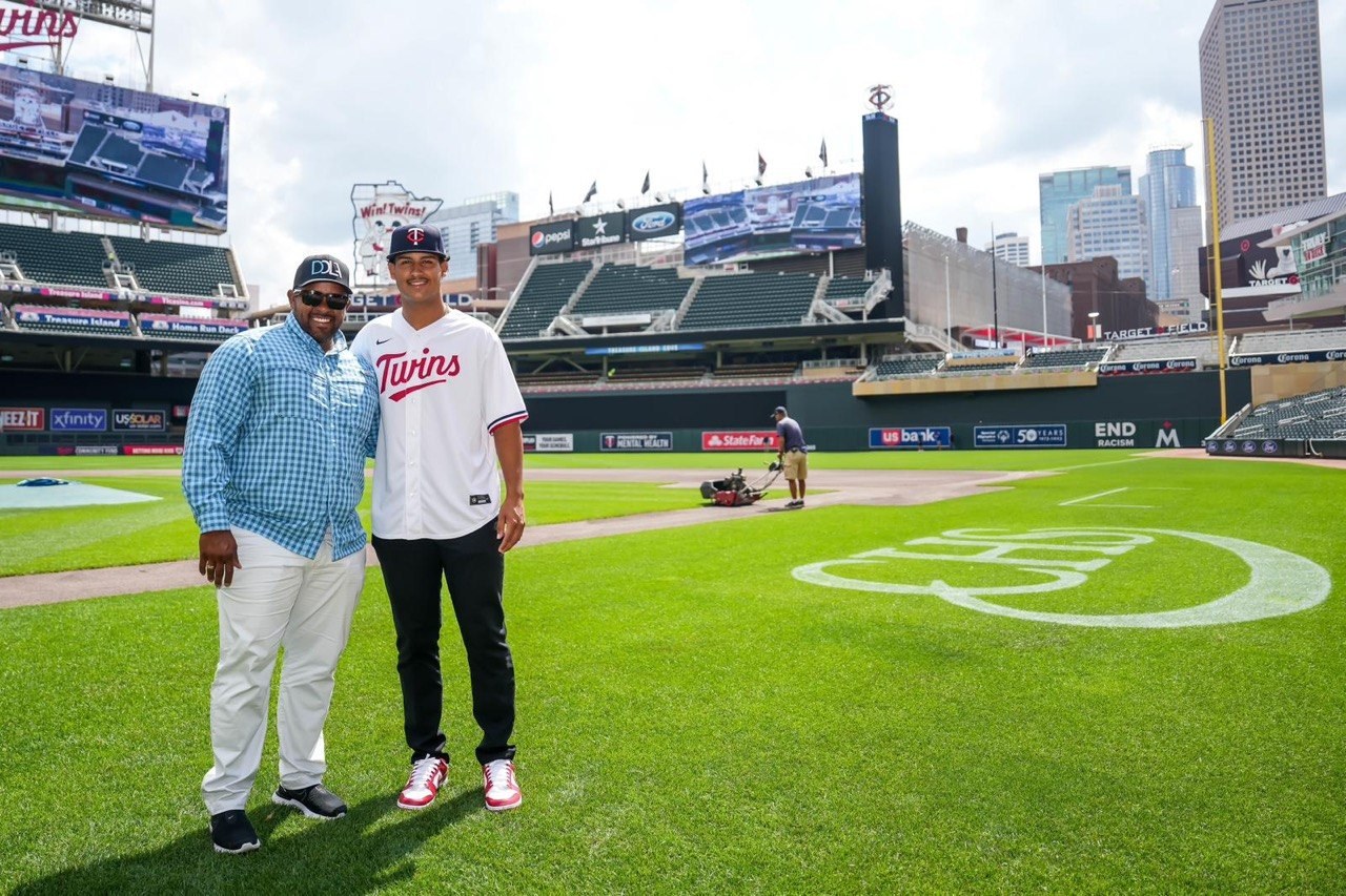 Coach Luis and the DDLA draftee on the field