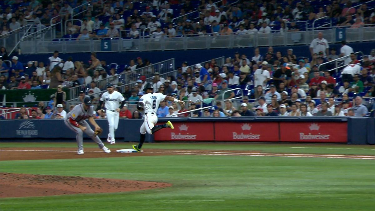 Otto Lopez sliding safely into a base